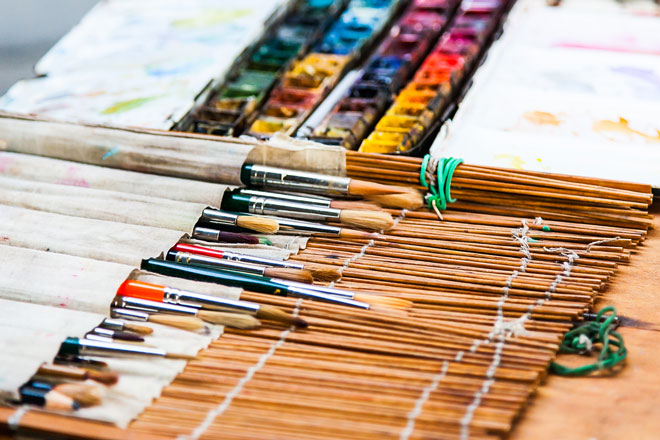 watercolor paintbrushes in an art brush holder